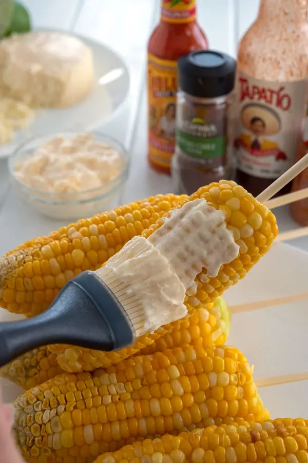 Elote recipe: brush with mayonnaise