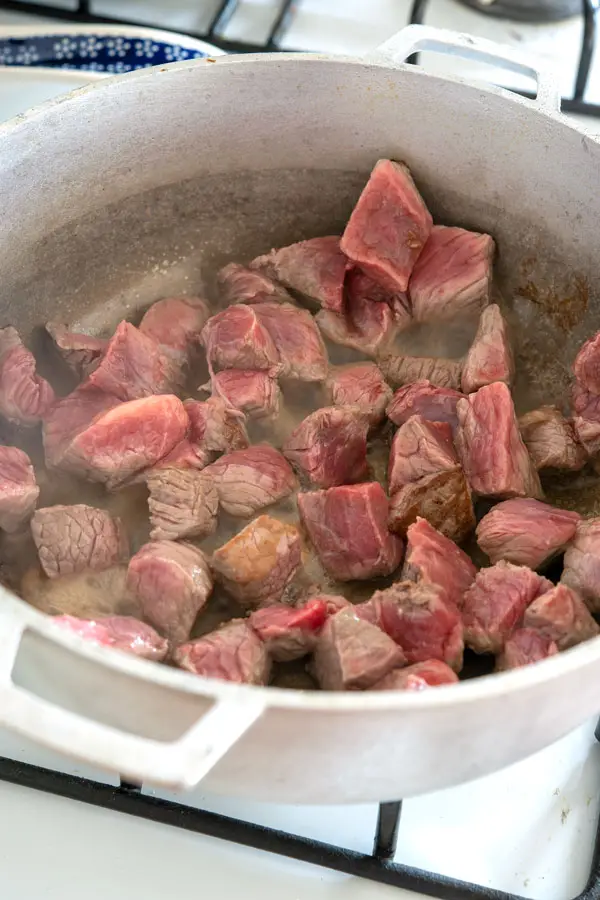 Browning the beef for Puerto Rican carne guisada