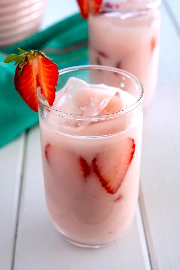 Glass of ice cold strawberry horchata