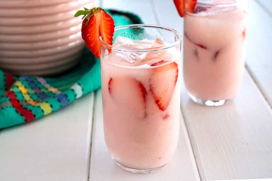 Glass of ice cold strawberry horchata