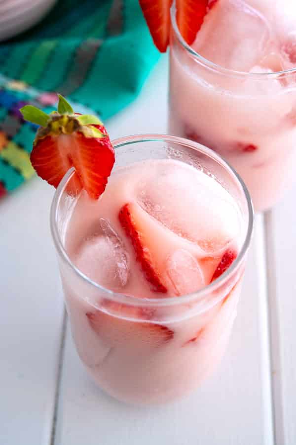 Glass of ice cold pink strawberry horchata