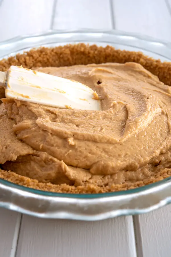 Spreading the filling in pie crust for no bake peanut butter pie