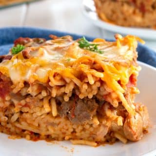 Slice of easy baked spaghetti on a white plate