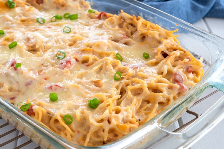 Glass casserole dish with baked chicken spaghetti