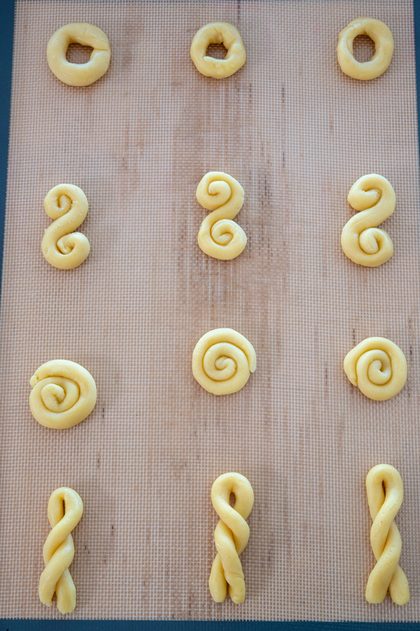 Cookie sheet of unbaked koulourakia cookies