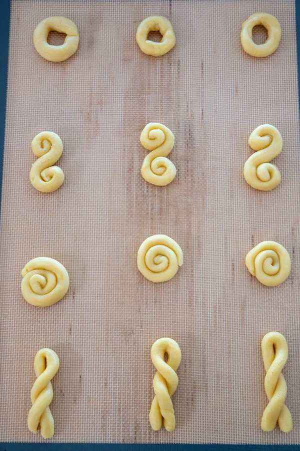 Cookie sheet of unbaked koulourakia cookies
