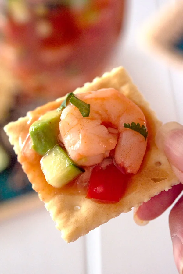 Saltine cracker with Mexican shrimp cocktail on top