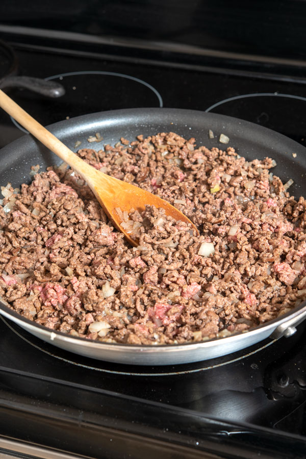 Browning ground beef in large pan for picadillo
