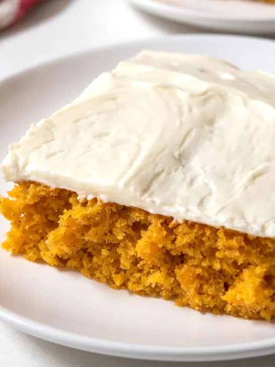 Close up of pumpkin bars with cream cheese frosting
